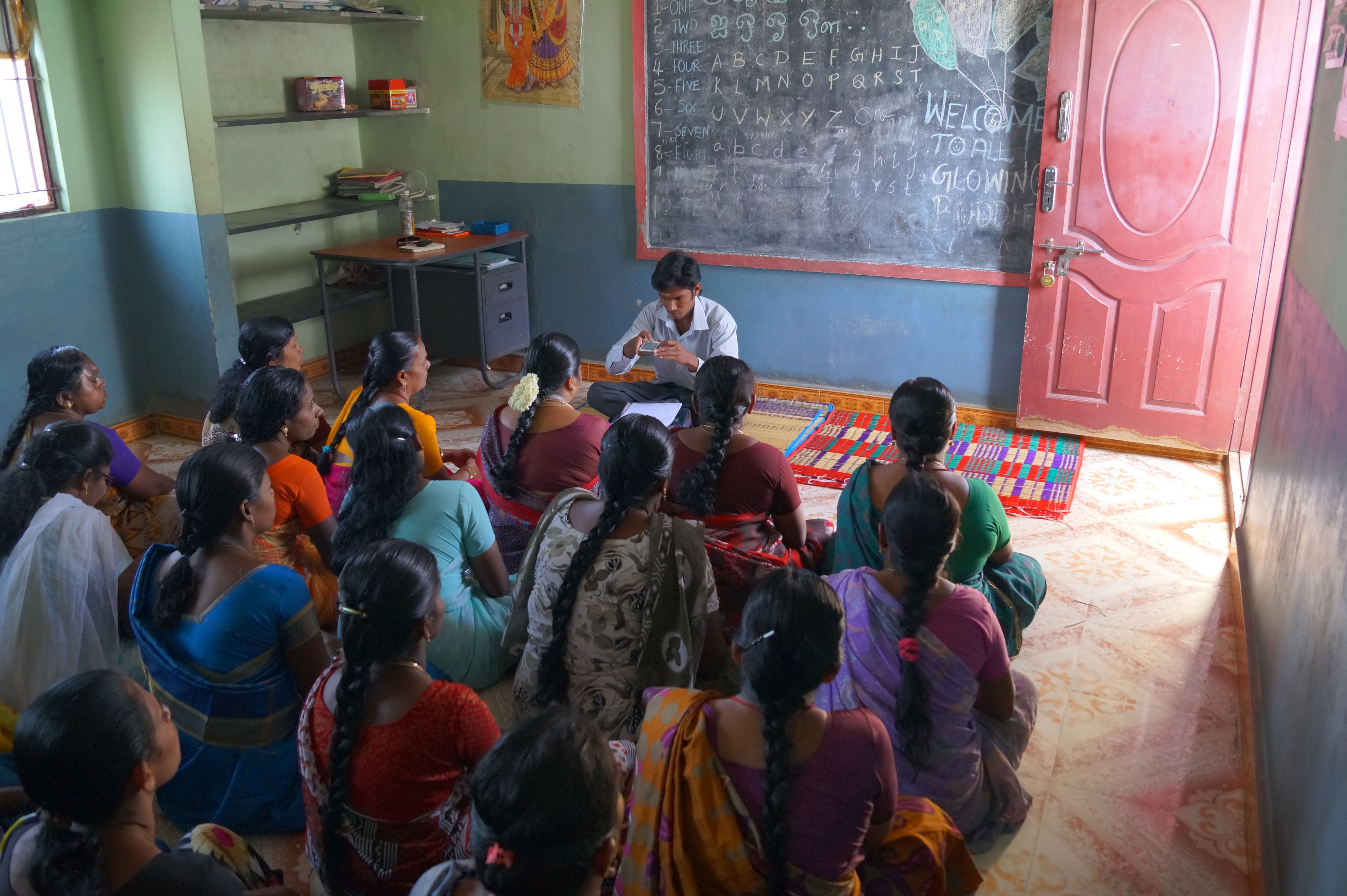 UFin field staff conducting a centre meeting with women borrowers in a rural setting